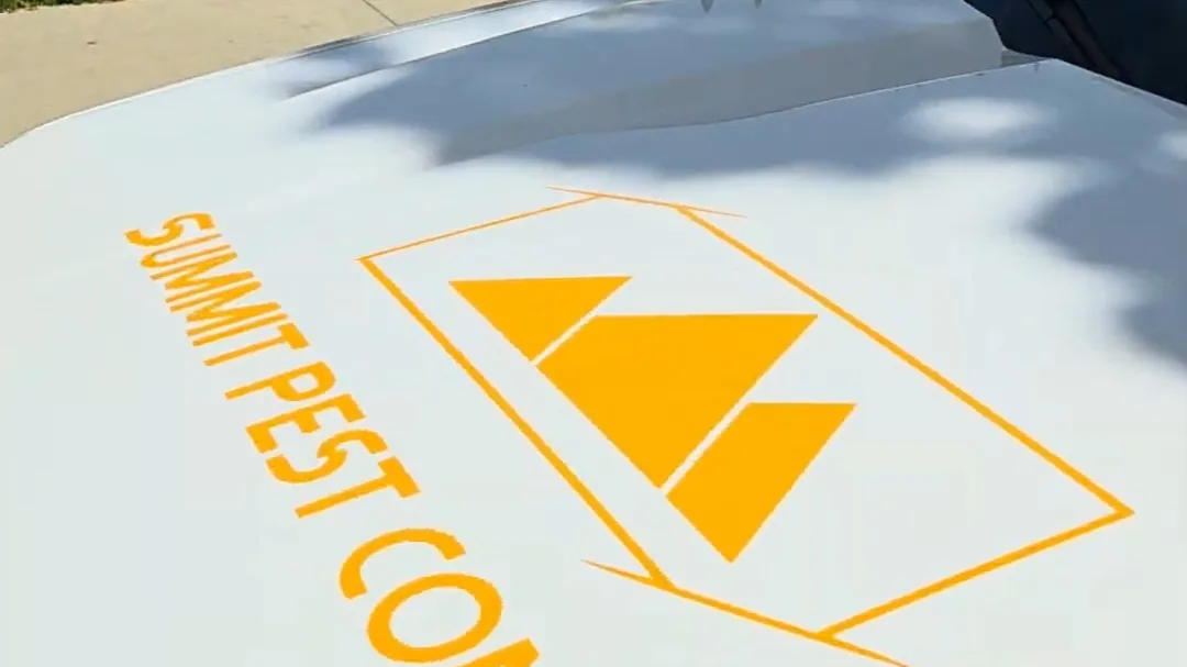 The Summit Pest Control wordmark on the company service truck